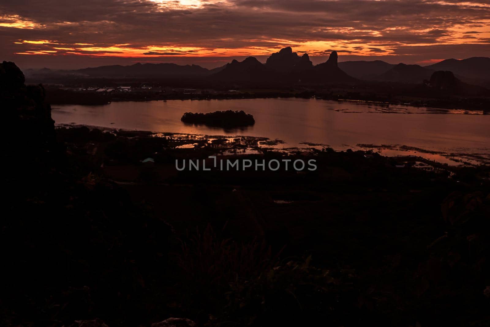 Panorama dramatic silhouette mountain landscape at sunset in the sea nature background