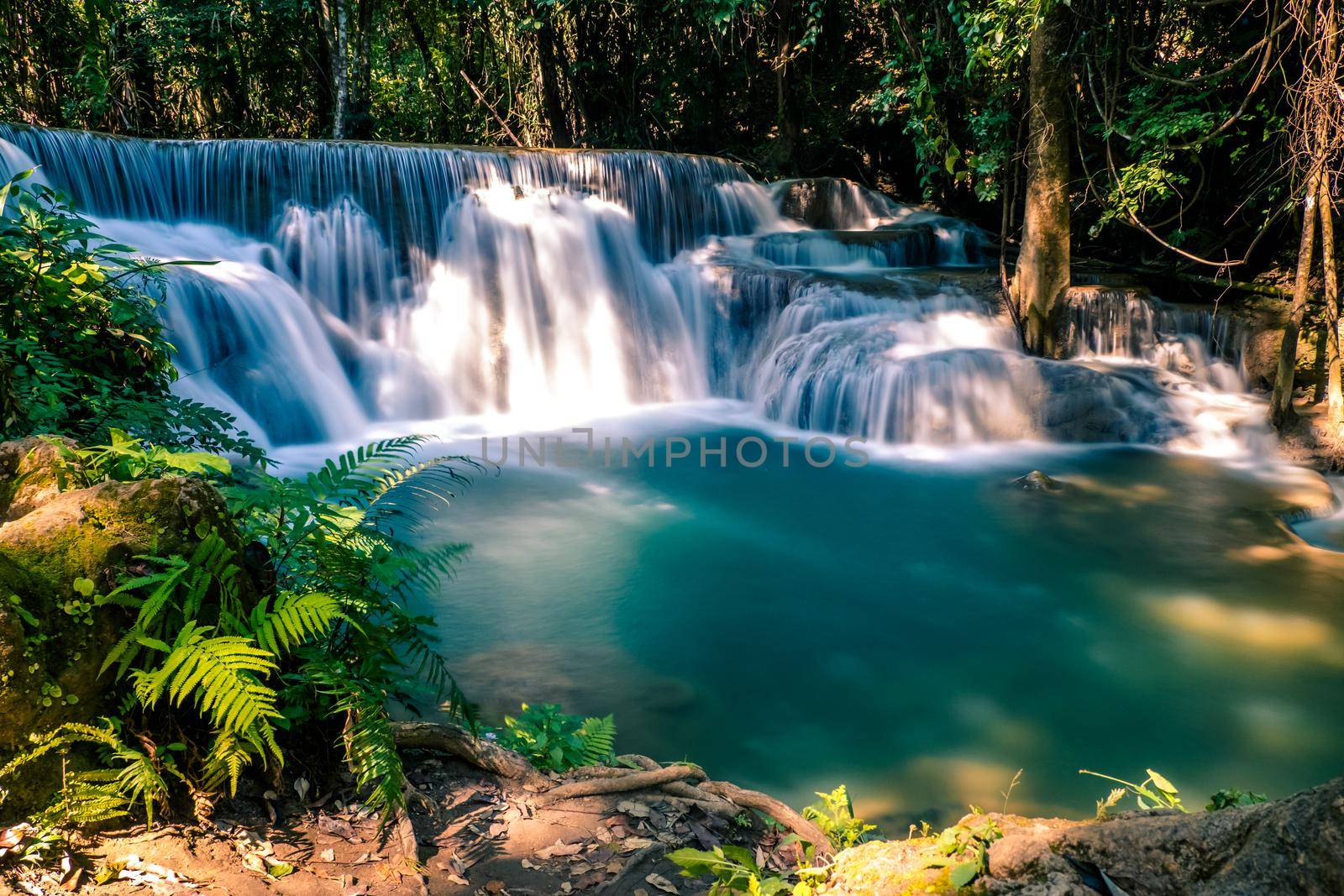 Long exposure exotic beautiful tropical deep rainforest waterfall Fresh turquoise waterfalls in deep forest of Huay Mae Khamin waterfall in the national park Beautiful landscape waterfalls.