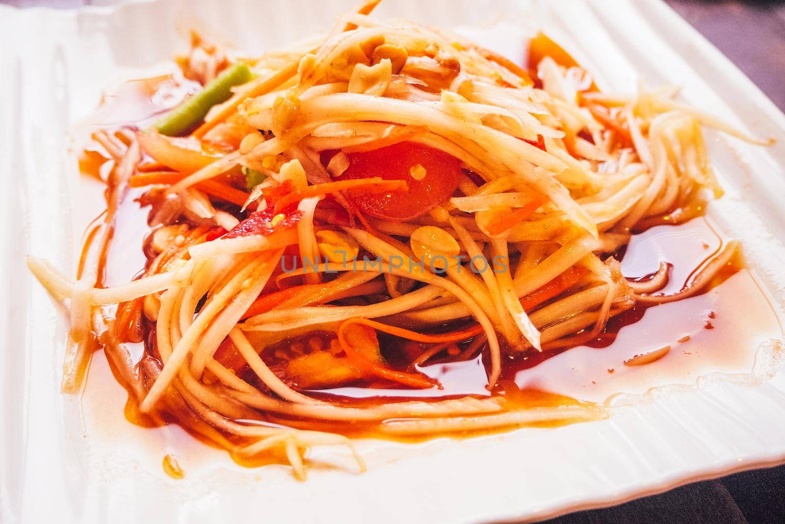 Thai Papaya salad with peanuts and dried shrimp. Asian food
