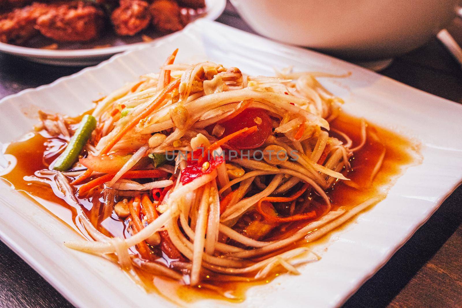 Thai Papaya salad with peanuts and dried shrimp. Asian food