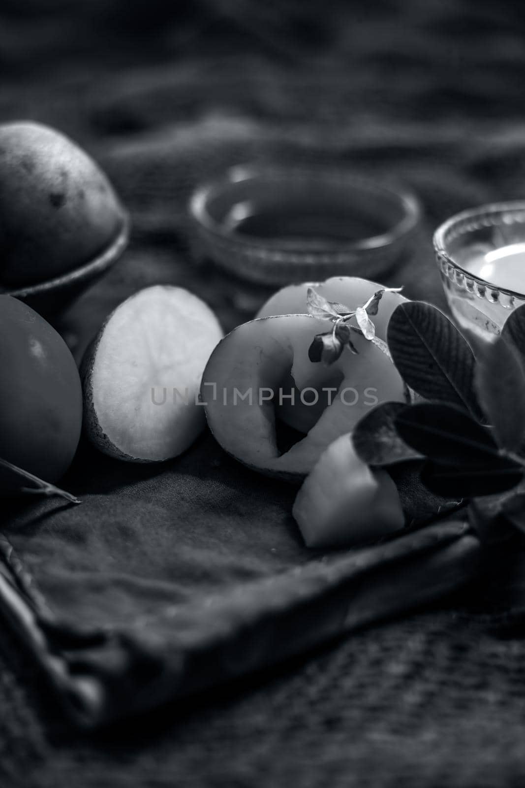 Potato juice's face pack for acne on jute bag's surface consisting of potato juice and tomato juice well mixed together with the help of honey.Vertical shot. by mirzamlk