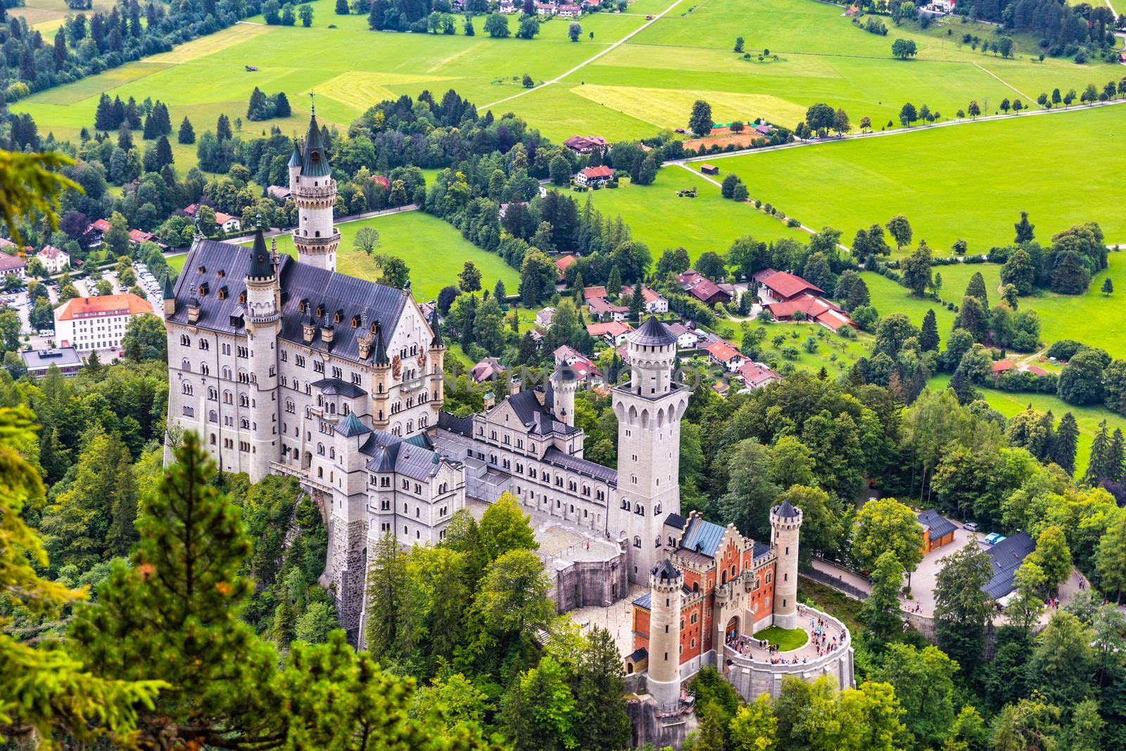 Famous Neuschwanstein Castle with scenic mountain landscape near Fussen, Bavaria, Germany. Neuschwanstein Castle in Hohenschwangau, Germany. 