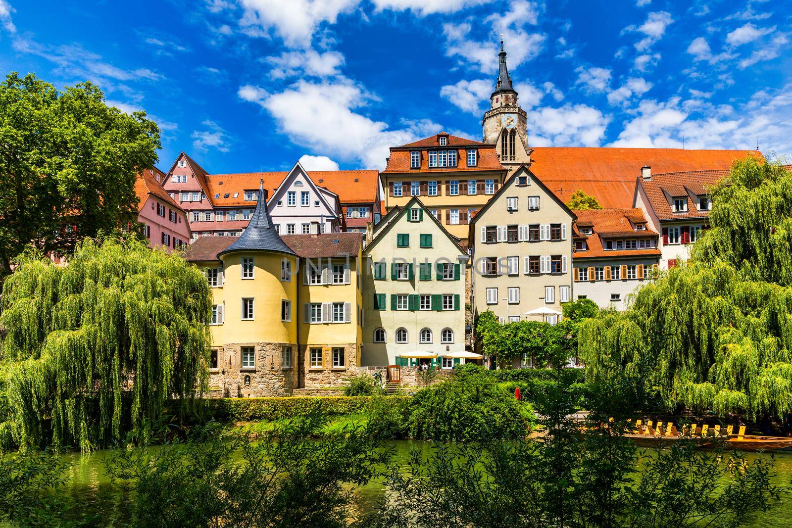 Beautiful floral colorful town Tubingen in Germany (Baden-Wurttemberg). Houses at river Neckar and Hoelderlin tower, Tuebingen, Baden-Wuerttemberg, Germany. Tubingen, Germany. 