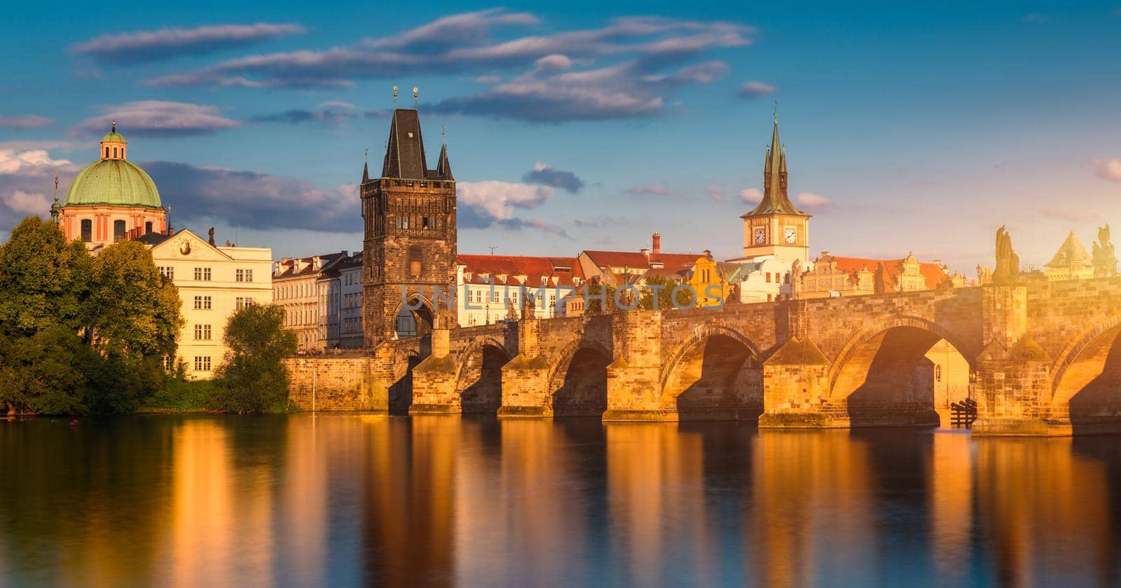 Old town of Prague. Czech Republic over river Vltava with Charles Bridge on skyline. Prague panorama landscape view with red roofs.  Prague view from Petrin Hill, Prague, Czechia.