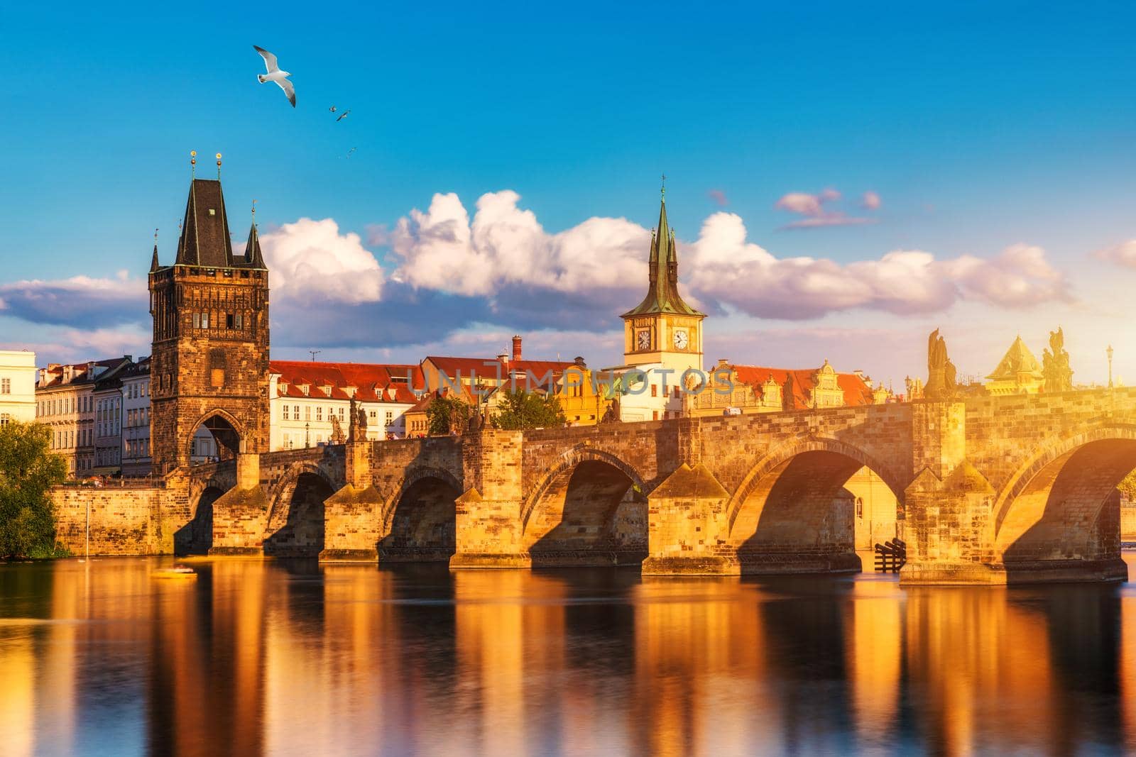Charles Bridge in Prague in Czechia. Prague, Czech Republic. Charles Bridge (Karluv Most) and Old Town Tower. Vltava River and Charles Bridge. Concept of world travel, sightseeing and tourism.