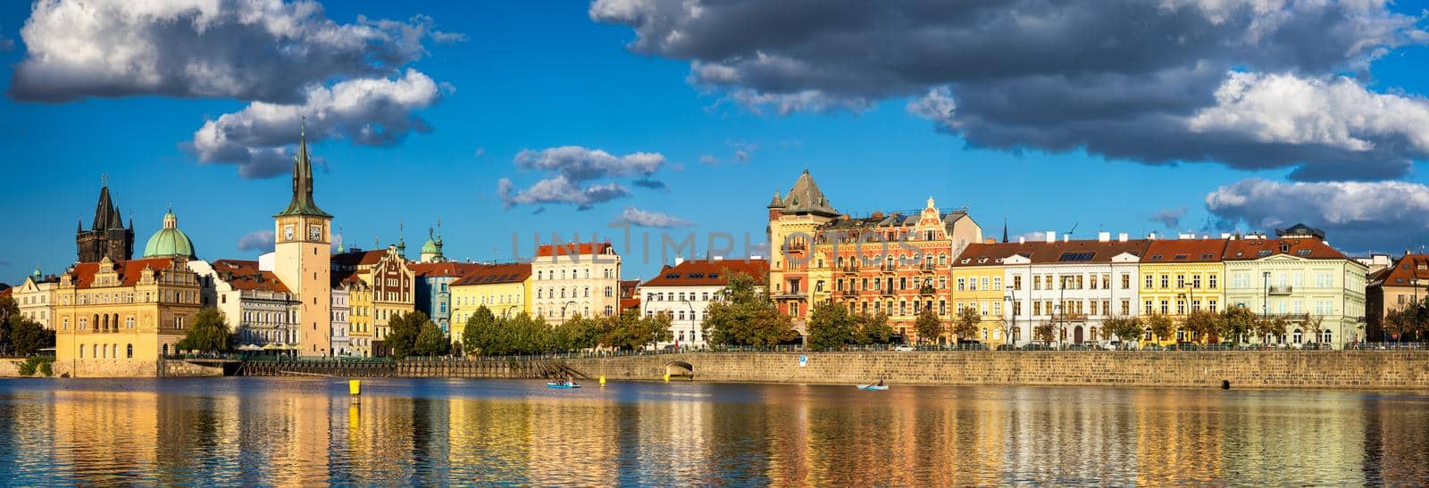 Old Town of Prague in Czechia. Prague, Czech Republic. Vltava River and old buildings across the river. Concept of world travel, sightseeing and tourism.