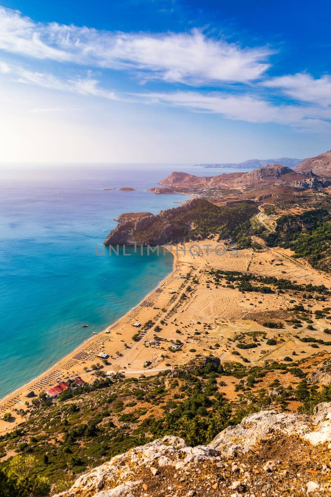 Tsampika beach with golden sand view from above, Rhodes, Greece. Aerial birds eye view of famous beach of Tsampika, Rhodes island, Dodecanese, Greece