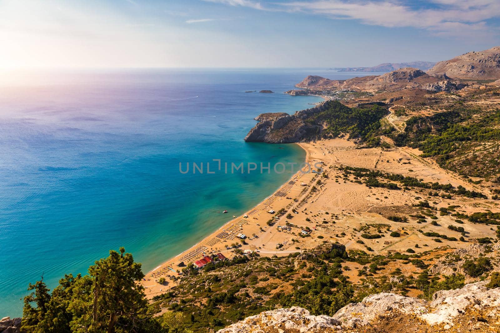 Tsampika beach with golden sand view from above, Rhodes, Greece. Aerial birds eye view of famous beach of Tsampika, Rhodes island, Dodecanese, Greece