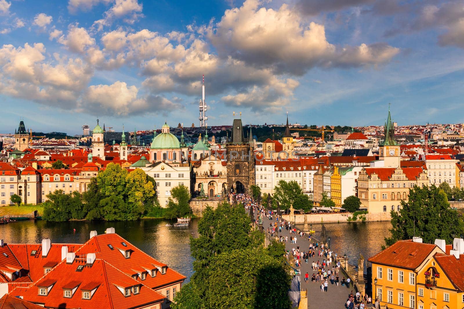 Old town of Prague. Czech Republic over river Vltava with Charles Bridge on skyline. Prague panorama landscape view with red roofs.  Prague view from Petrin Hill, Prague, Czechia.