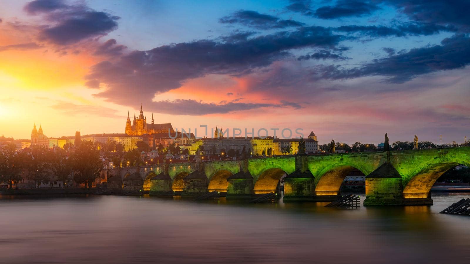 Charles Bridge in Prague in Czechia. Prague, Czech Republic. Charles Bridge (Karluv Most) and Old Town Tower. Vltava River and Charles Bridge. Concept of world travel, sightseeing and tourism.