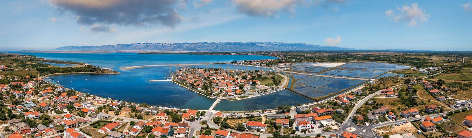 Historic town of Nin laguna aerial view with Velebit mountain background, Dalmatia region of Croatia. Aerial view of the famous Nin lagoon and medieval in Croatia