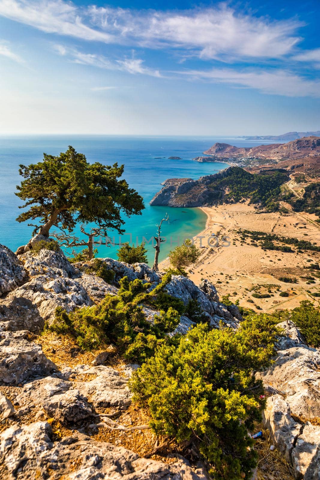 Tsampika beach with golden sand view from above, Rhodes, Greece. Aerial birds eye view of famous beach of Tsampika, Rhodes island, Dodecanese, Greece