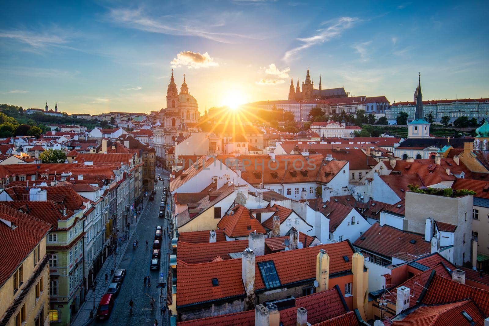 St. Vitus Cathedral, Prague Castle and Lesser Town panorama. View of St. Vitus Cathedral, Prague Castle and red roofs. Prague, Czech Republic. View of Prague Castle at sunset. Prague, Czech Republic 