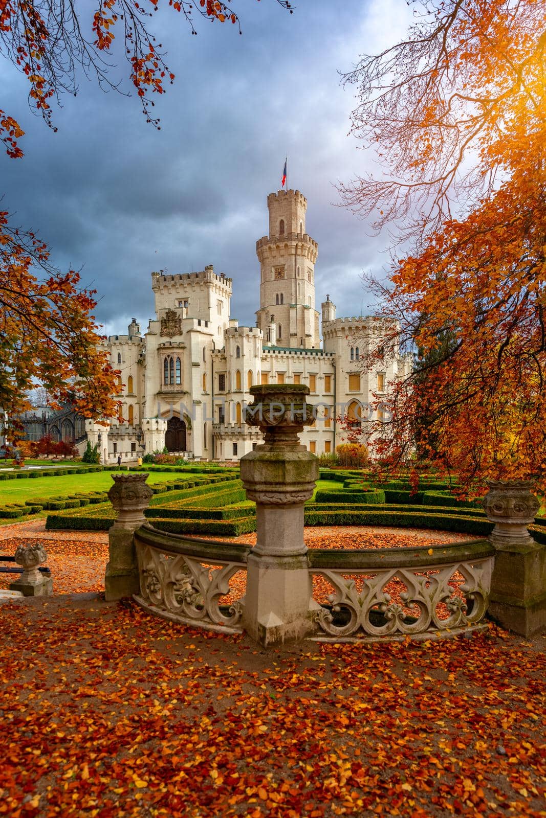 Castle Hluboka nad Vltavou is one of the most beautiful castles in Czech Republic. Castle Hluboka nad Vltavou in autumn with red foliage, Czechia. Colorful autumn view of Hluboka nad Vltavou castle.