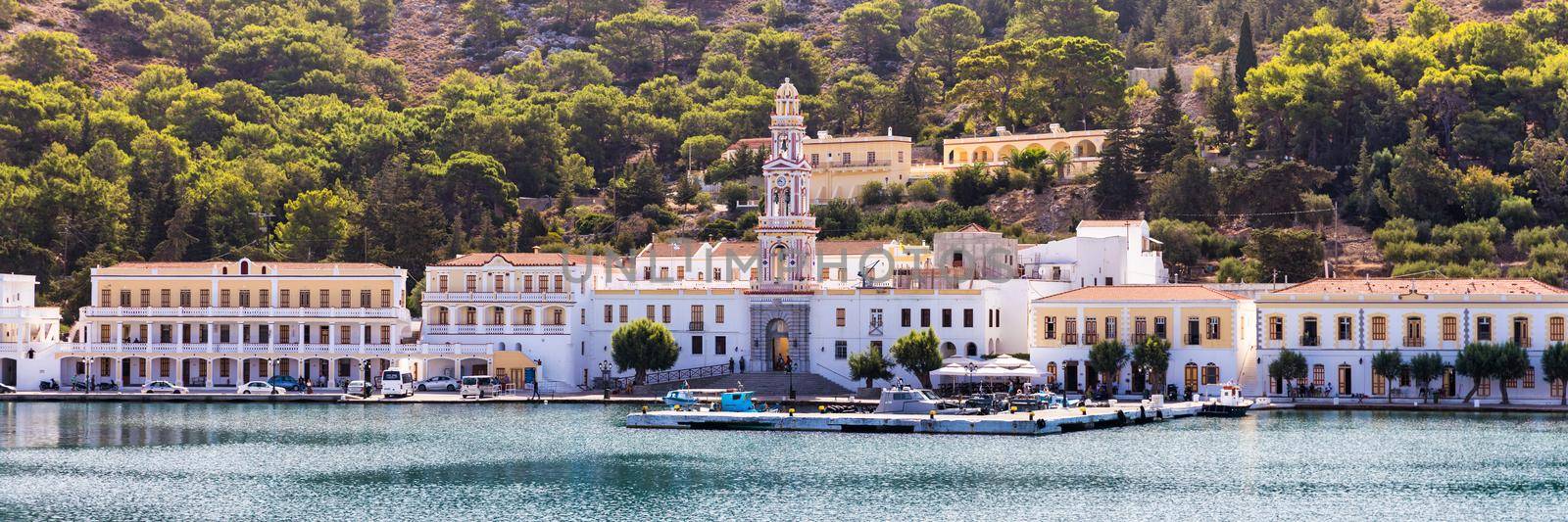 Sacred Monastery of Saint Archangel Michael the Panormitis, Symi, Greece. Monastery of Saint Archangel Michael, sacred place on coast of sea Aegean Symi island in Greece overlooking Panormitis port.