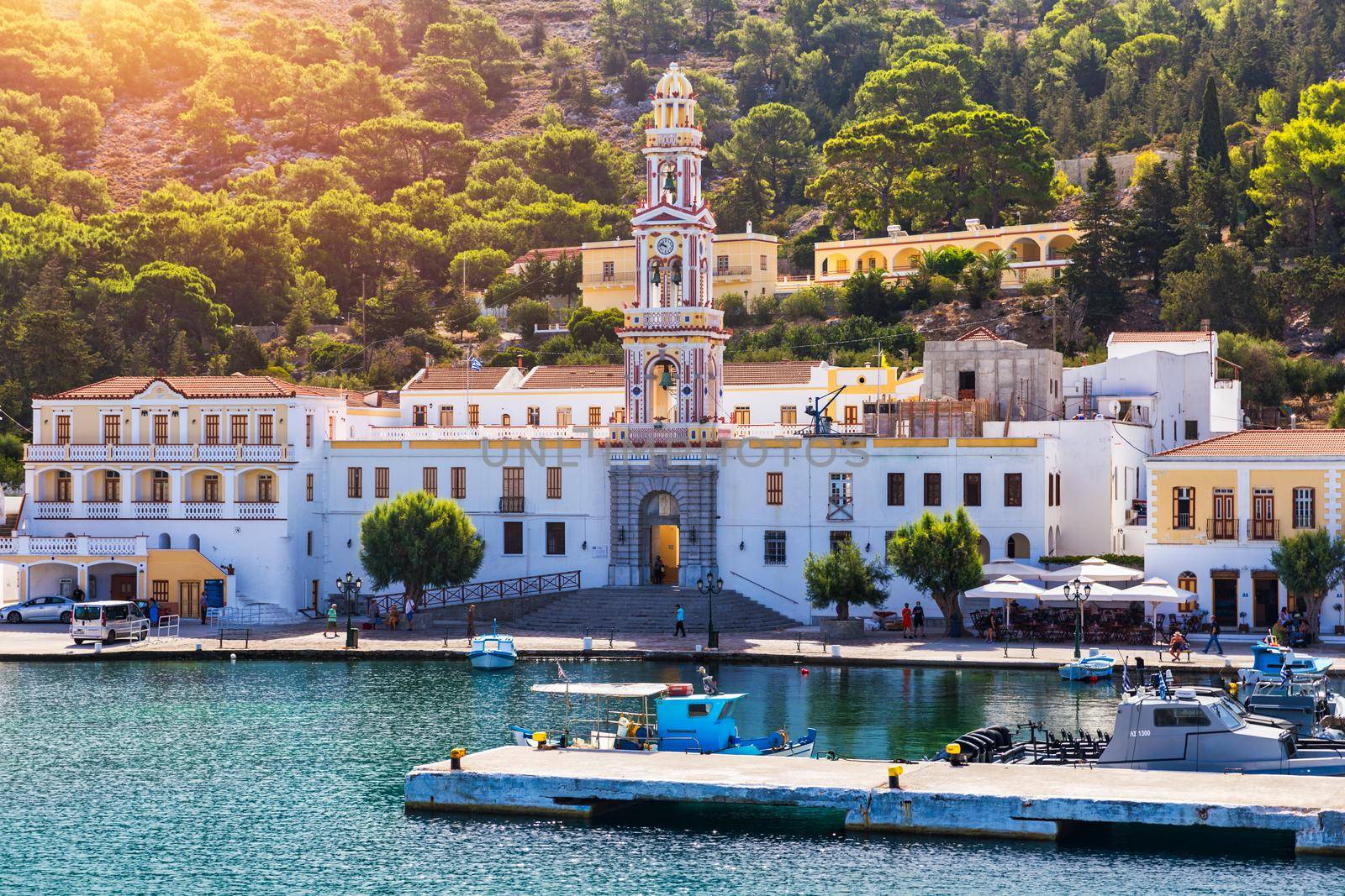 Sacred Monastery of Saint Archangel Michael the Panormitis, Symi, Greece. Monastery of Saint Archangel Michael, sacred place on coast of sea Aegean Symi island in Greece overlooking Panormitis port.