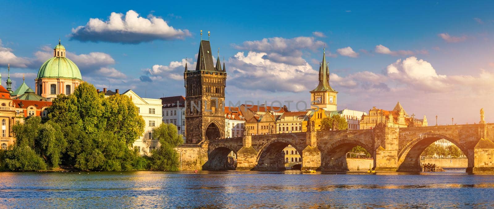 Charles Bridge in Prague in Czechia. Prague, Czech Republic. Charles Bridge (Karluv Most) and Old Town Tower. Vltava River and Charles Bridge. Concept of world travel, sightseeing and tourism.