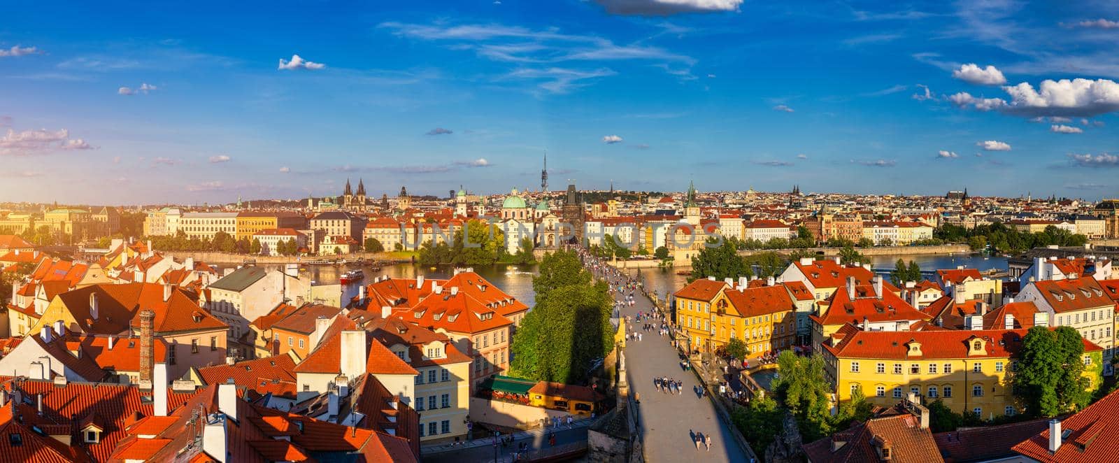 Old town of Prague. Czech Republic over river Vltava with Charles Bridge on skyline. Prague panorama landscape view with red roofs.  Prague view from Petrin Hill, Prague, Czechia.