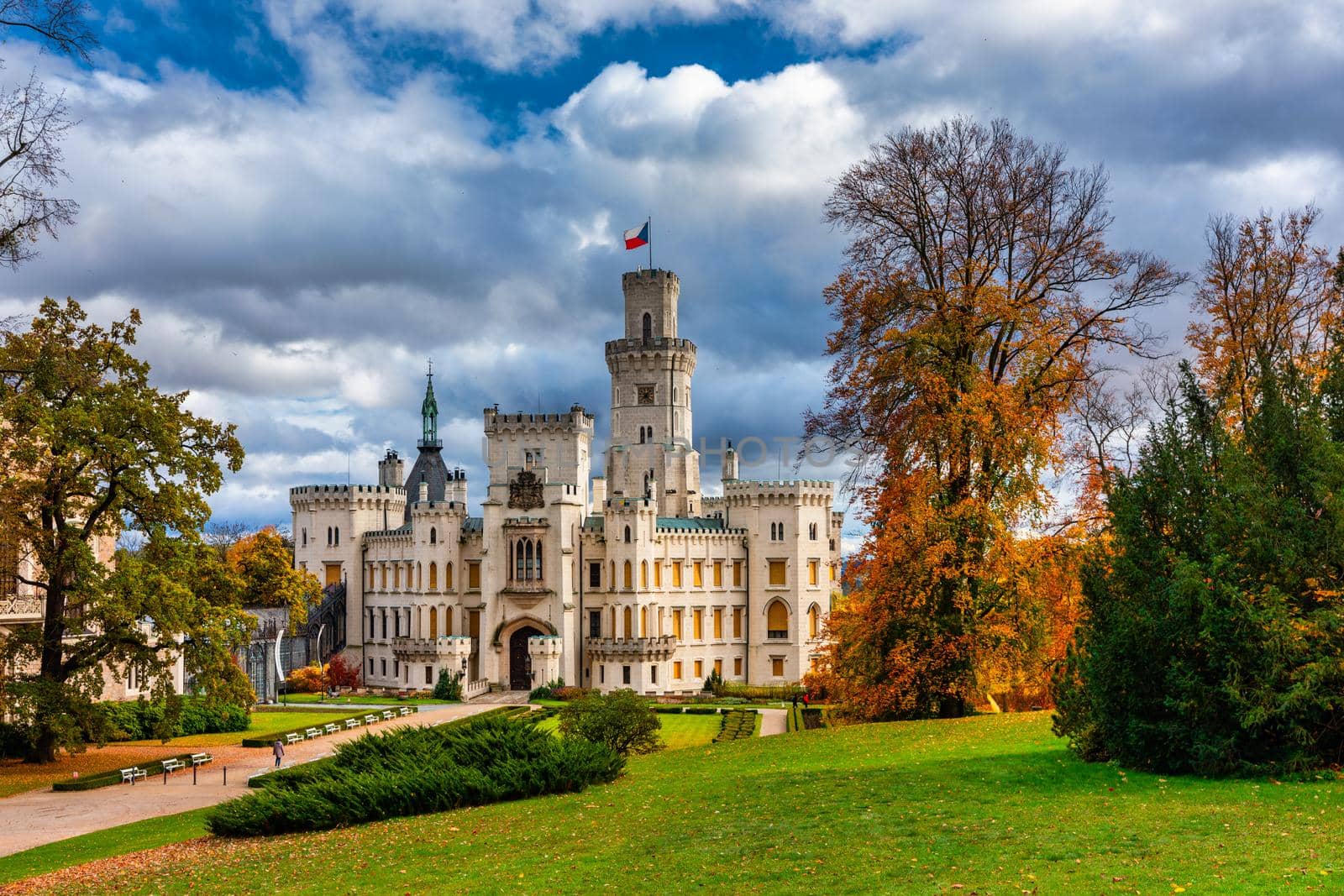Castle Hluboka nad Vltavou is one of the most beautiful castles in Czech Republic. Castle Hluboka nad Vltavou in autumn with red foliage, Czechia. Colorful autumn view of Hluboka nad Vltavou castle.