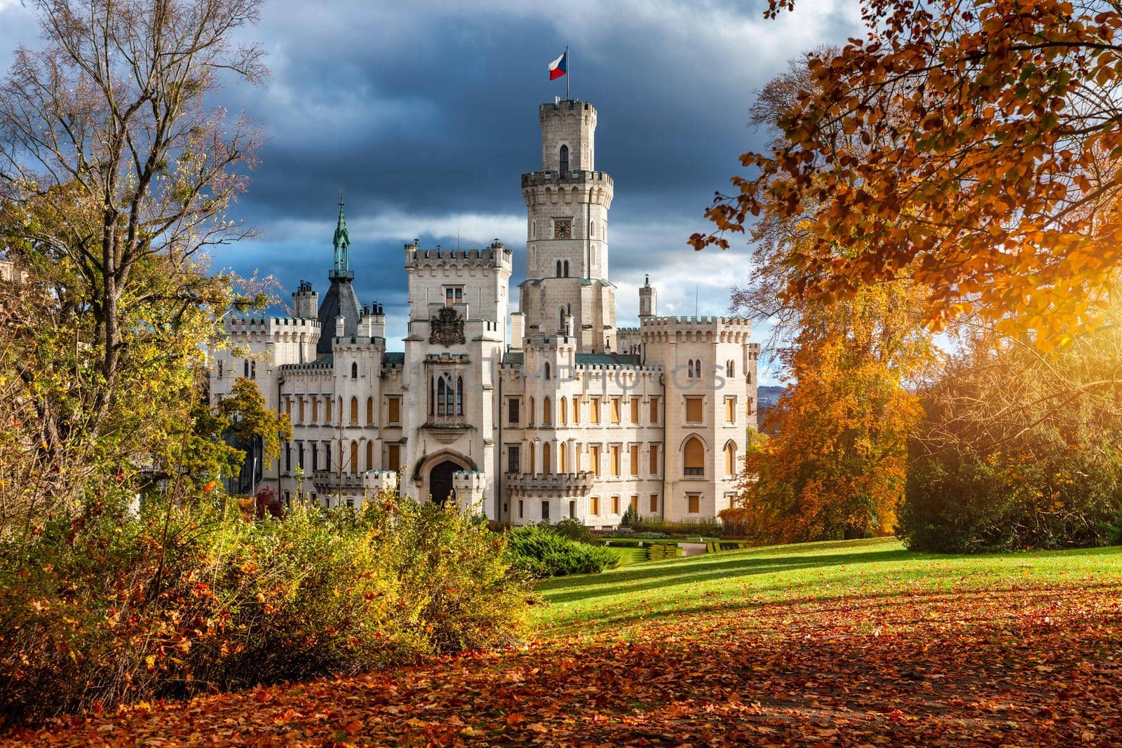 Castle Hluboka nad Vltavou is one of the most beautiful castles in Czech Republic. Castle Hluboka nad Vltavou in autumn with red foliage, Czechia. Colorful autumn view of Hluboka nad Vltavou castle.