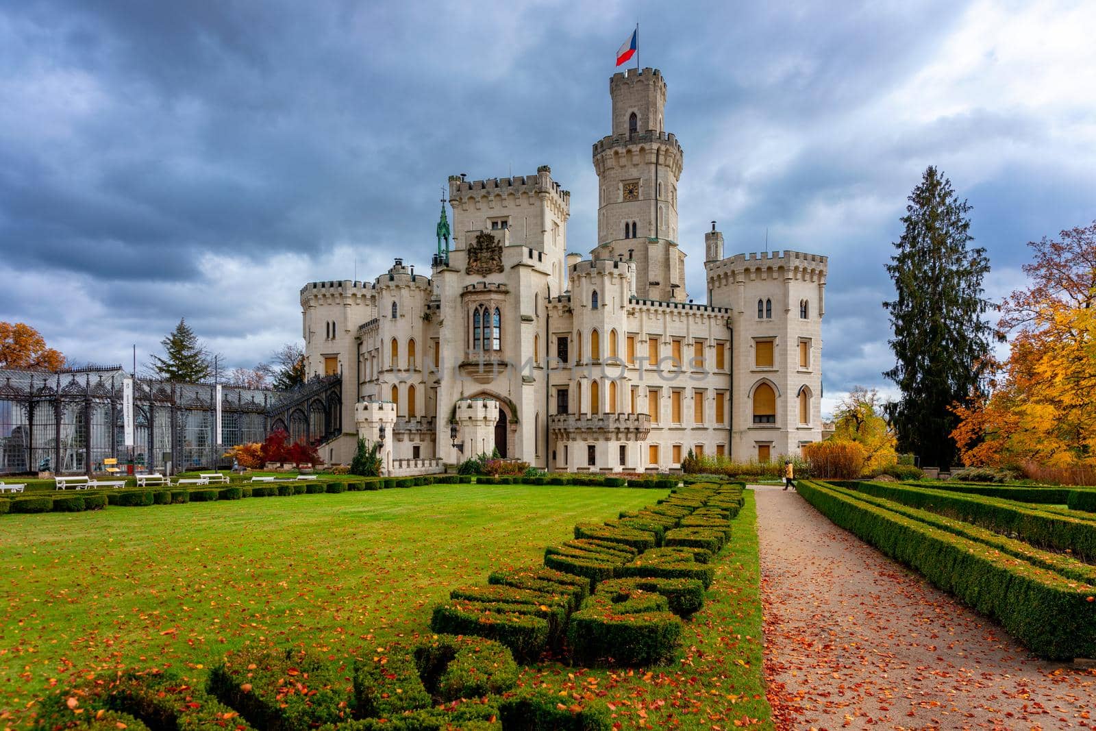 Castle Hluboka nad Vltavou is one of the most beautiful castles in Czech Republic. Castle Hluboka nad Vltavou in autumn with red foliage, Czechia. Colorful autumn view of Hluboka nad Vltavou castle.
