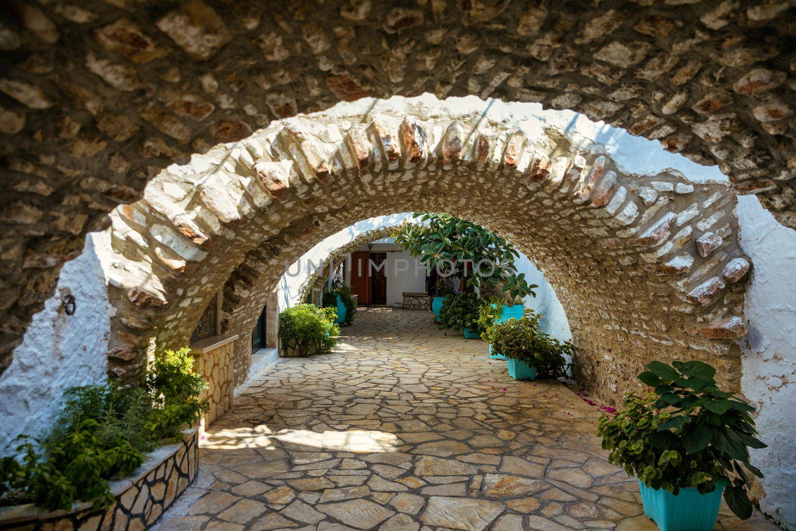 Courtyard of the Theotokos Monastery also known as Paleokastritsa Monastery, Corfu, Greece. Theotokos Monastery, Paleokastritsa town. Monastery of Virgin Mary, Paleokastritsa, Corfu, Greece.