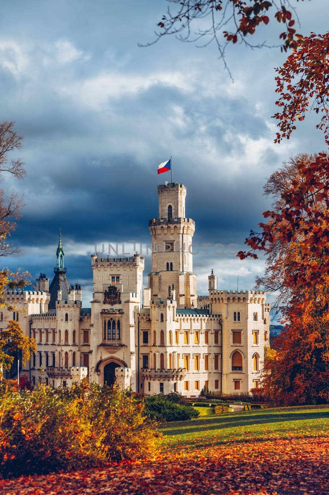 Castle Hluboka nad Vltavou is one of the most beautiful castles in Czech Republic. Castle Hluboka nad Vltavou in autumn with red foliage, Czechia. Colorful autumn view of Hluboka nad Vltavou castle.