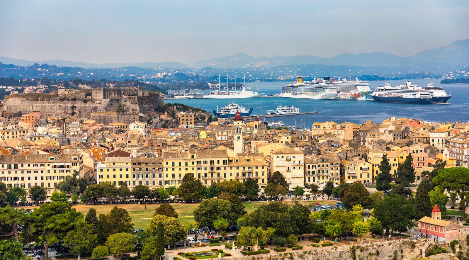 Panoramic view of Kerkyra, capital of Corfu island, Greece. View of Kerkyra with beautiful buildings during summer sunny day. Corfu island, Greece. 