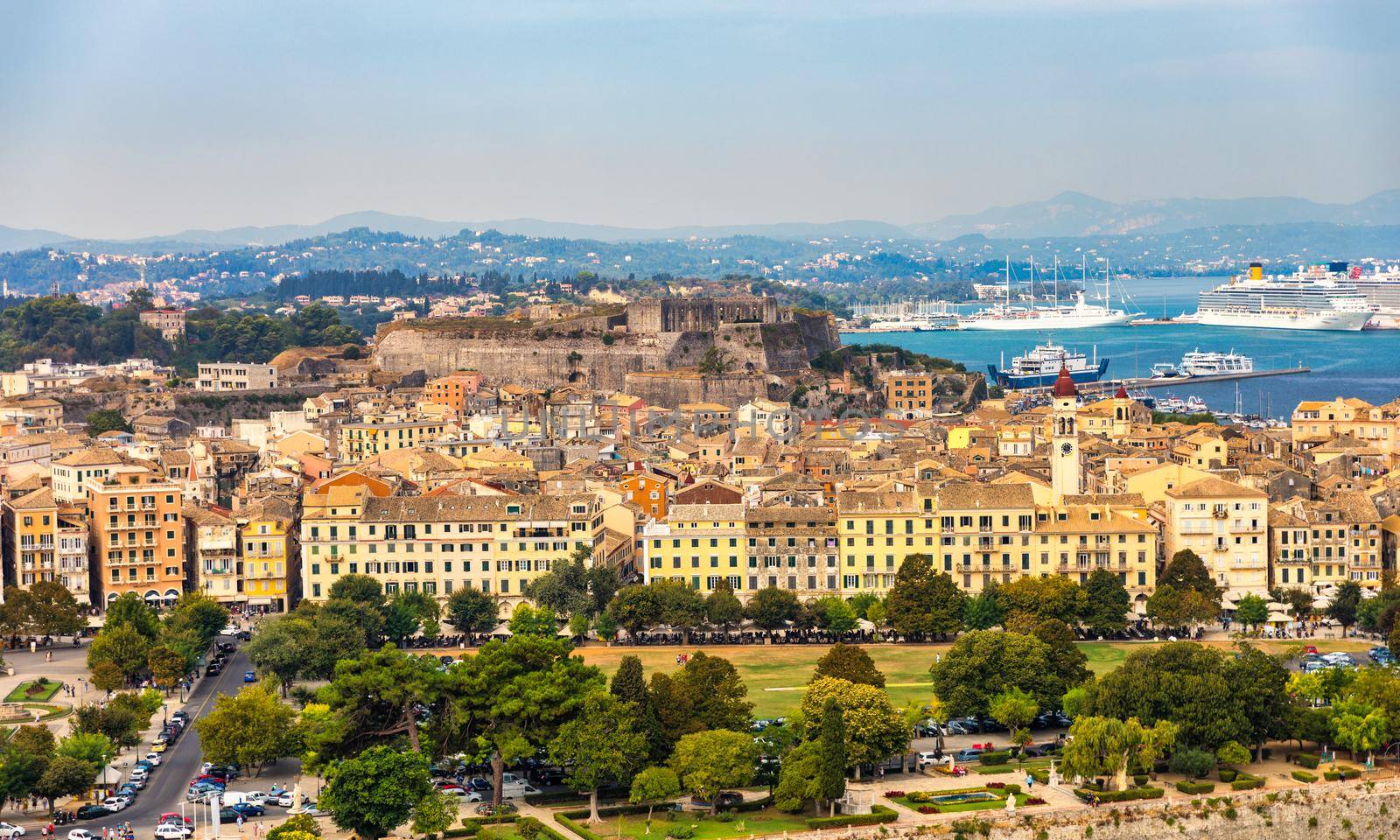 Panoramic view of Kerkyra, capital of Corfu island, Greece. View of Kerkyra with beautiful buildings during summer sunny day. Corfu island, Greece. 
