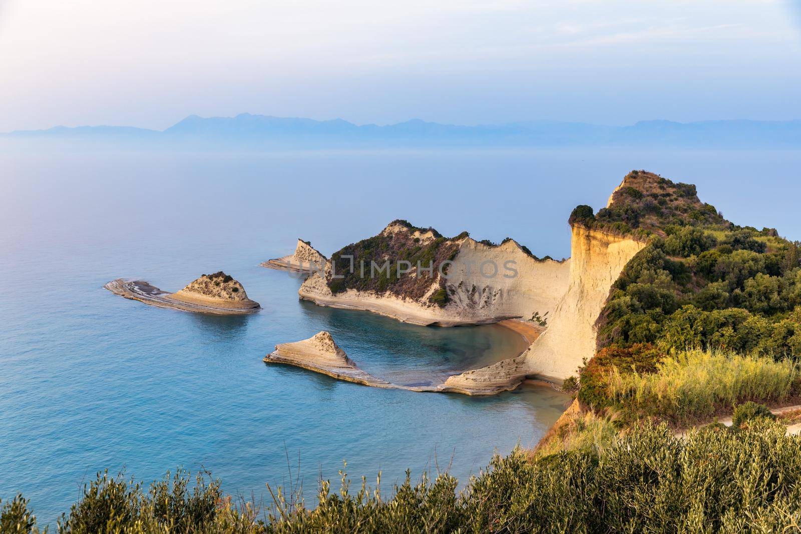 Beautiful view of Cape Drastis in the island of Corfu in Greece. Cape Drastis, the impressive formations of the ground, rocks and the blue waters panorama, Cape Drastis, Corfu, Greece, Ionian Islands.