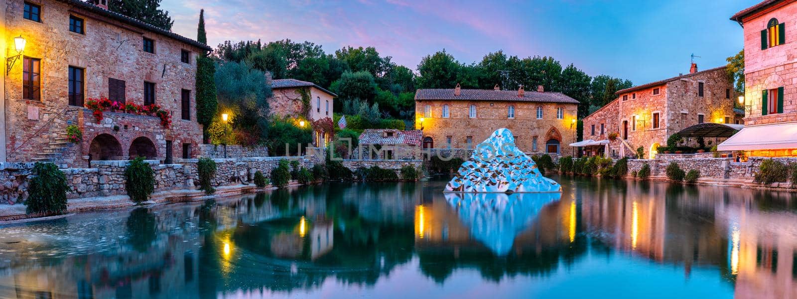 Thermal bath town of Bagno Vignoni, Italy during sunrise. Old thermal baths in the medieval village Bagno Vignoni, Tuscany, Italy. Medieval thermal baths in village Bagno Vignoni, Tuscany, Italy 