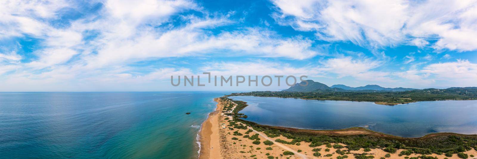 Issos beach on Corfu, near Agios Georgios, Greece. Aerial drone view of Issos beach and Lake Korission, Corfu island, Ionian Sea, Greece. Issos beach, Corfu Island.