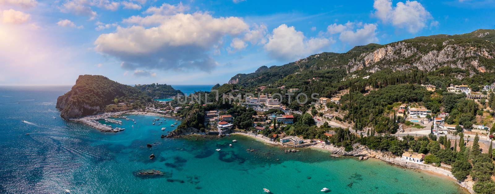 Picturesque seaside of Paleokastritsa, Corfu, Greece. Beautiful bay in Paleokastritsa in Corfu island, Greece. Panoramic view of Palaiokastritsa, boats and beach Corfu, Greece