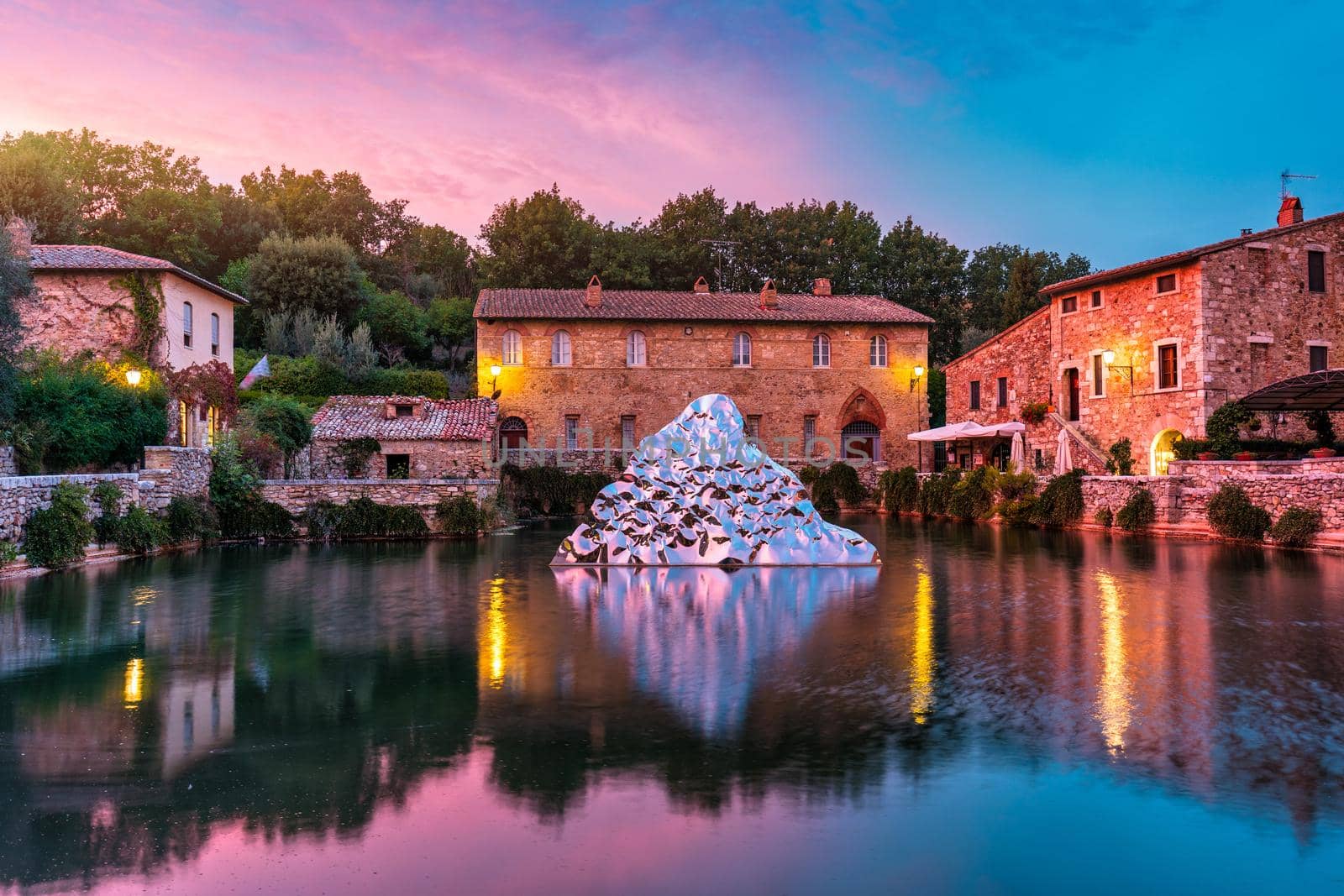 Thermal bath town of Bagno Vignoni, Italy during sunrise. Old thermal baths in the medieval village Bagno Vignoni, Tuscany, Italy. Medieval thermal baths in village Bagno Vignoni, Tuscany, Italy 