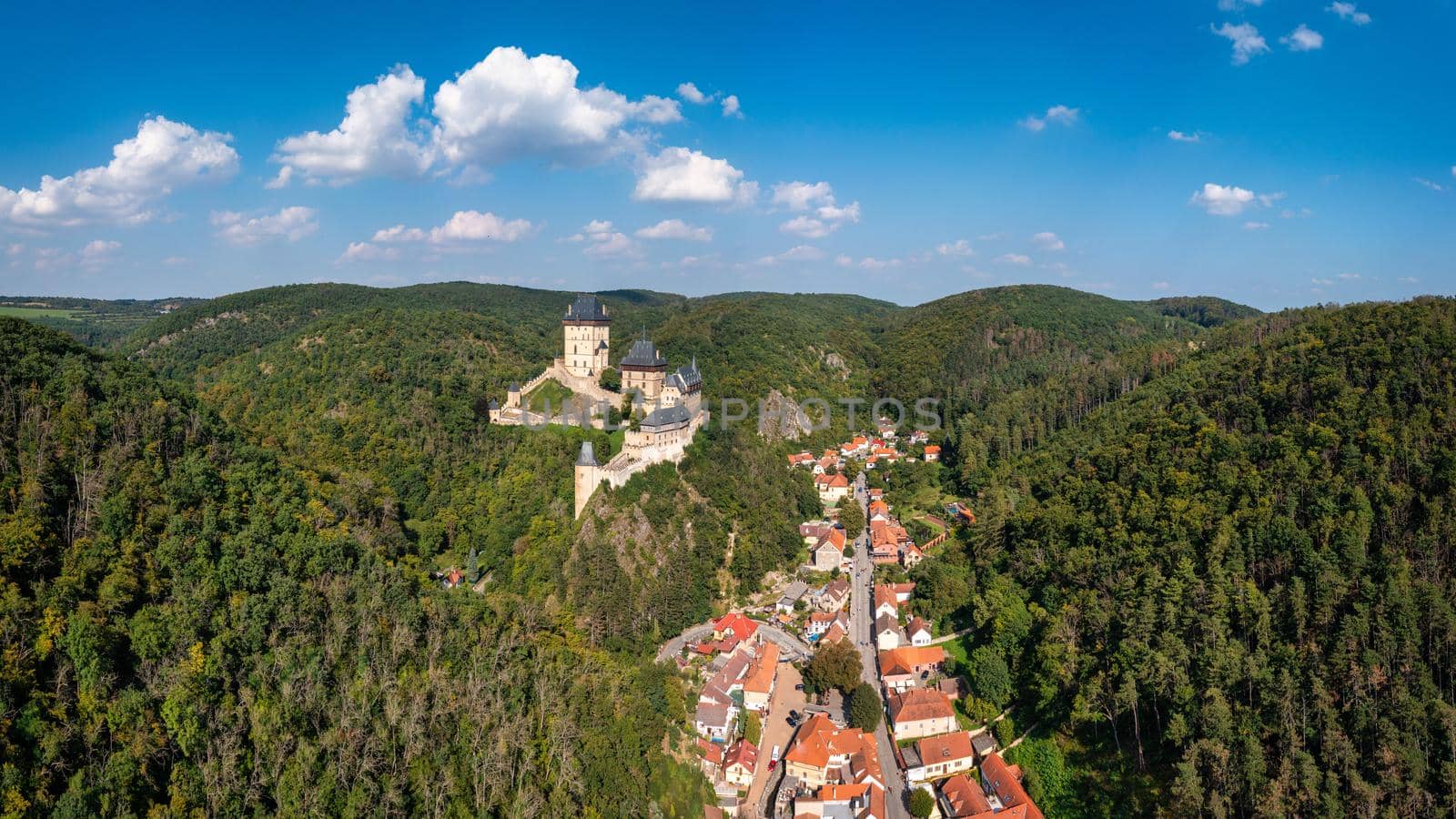Royal Castle Karlstejn. Central Bohemia, Karlstejn village, Czechia. Aerial view to The Karlstejn castle. Royal palace founded King Charles IV. Amazing gothic monument in Czech Republic, Europe.