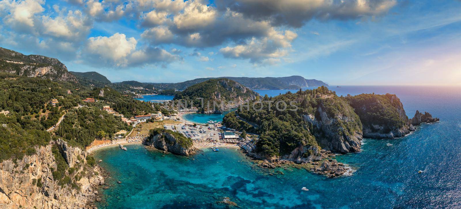 Picturesque seaside of Paleokastritsa, Corfu, Greece. Beautiful bay in Paleokastritsa in Corfu island, Greece. Panoramic view of Palaiokastritsa, boats and beach Corfu, Greece