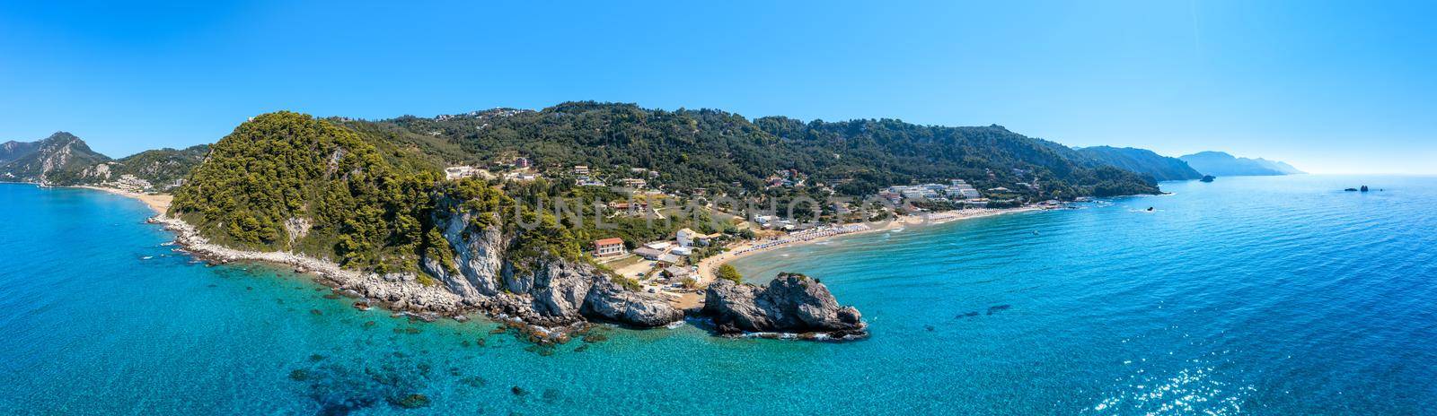 Aerial drone view over western coast and Glyfada beach, Island of Corfu, Greece. Glyfada Beach at Corfu Greece during the day. 