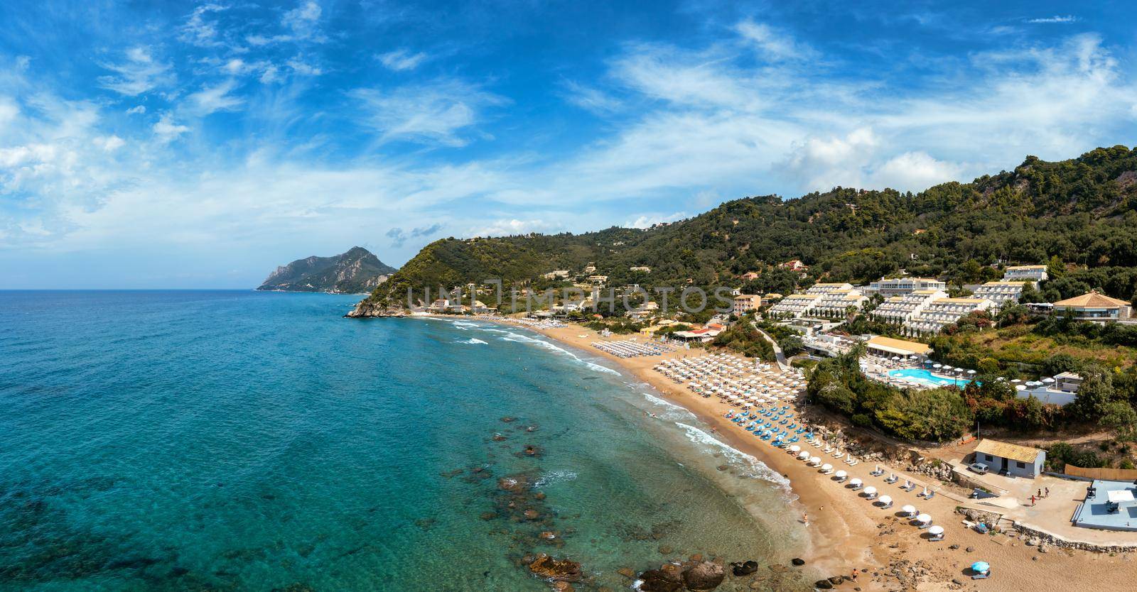 Aerial drone view over western coast and Glyfada beach, Island of Corfu, Greece. Glyfada Beach at Corfu Greece during the day. 