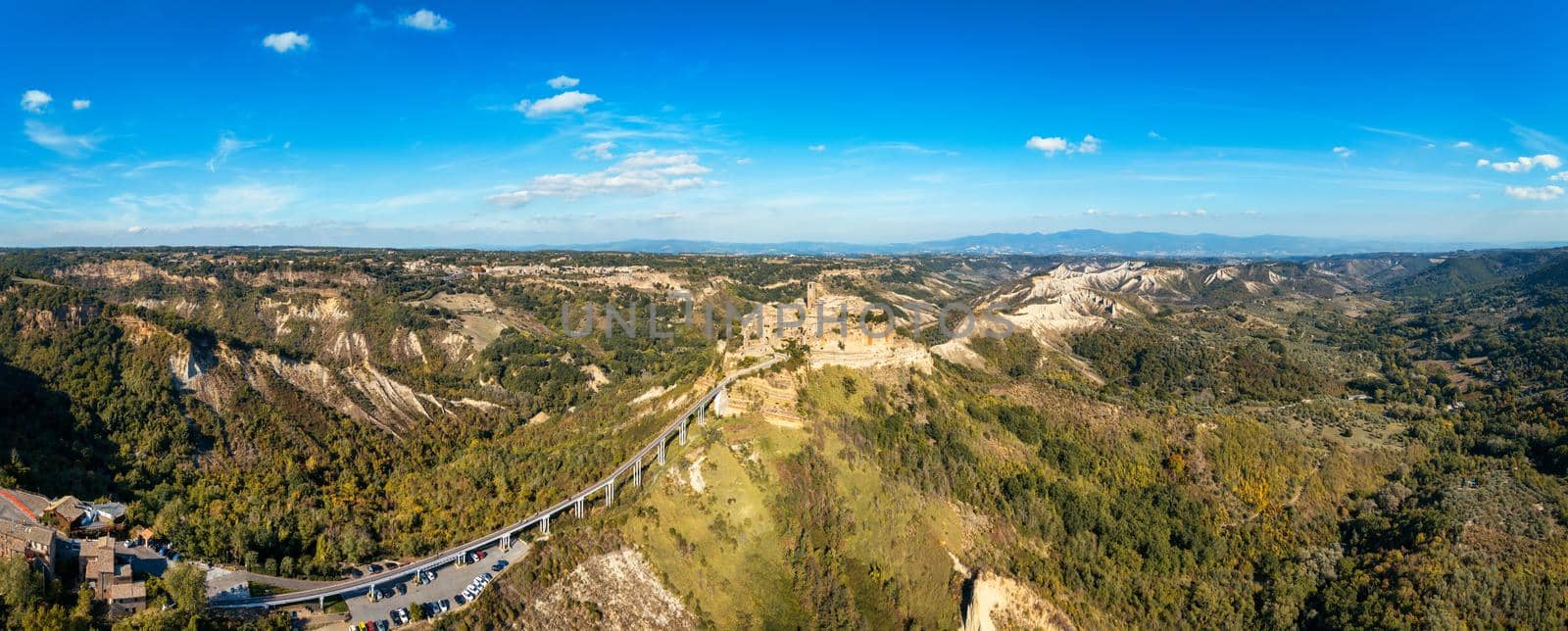 The famous Civita di Bagnoregio on a sunny day. Province of Viterbo, Lazio, Italy. Medieval town on the mountain, Civita di Bagnoregio, popular touristic stop at Tuscany, Italy.