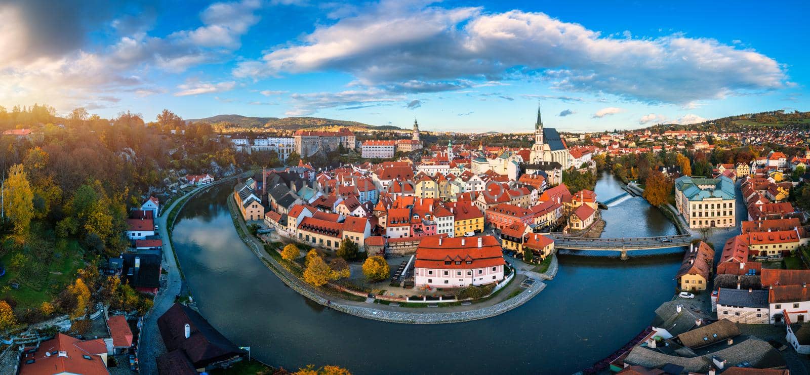 Panoramic view of Cesky Krumlov town on Vltava riverbank on autumn day overlooking medieval Castle, Czech Republic. View of old town of Cesky Krumlov, South Bohemia, Czech Republic.