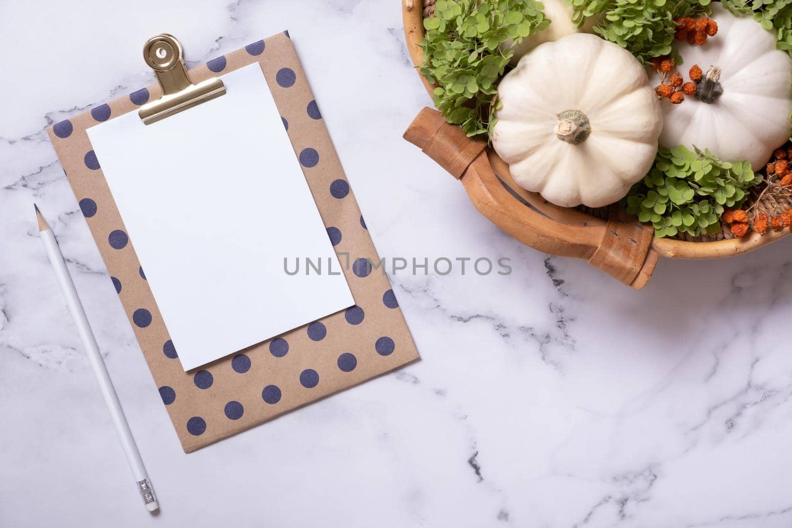 Autumn flat lay with blank tablet and decorative pumpkins on marble background top view by ssvimaliss