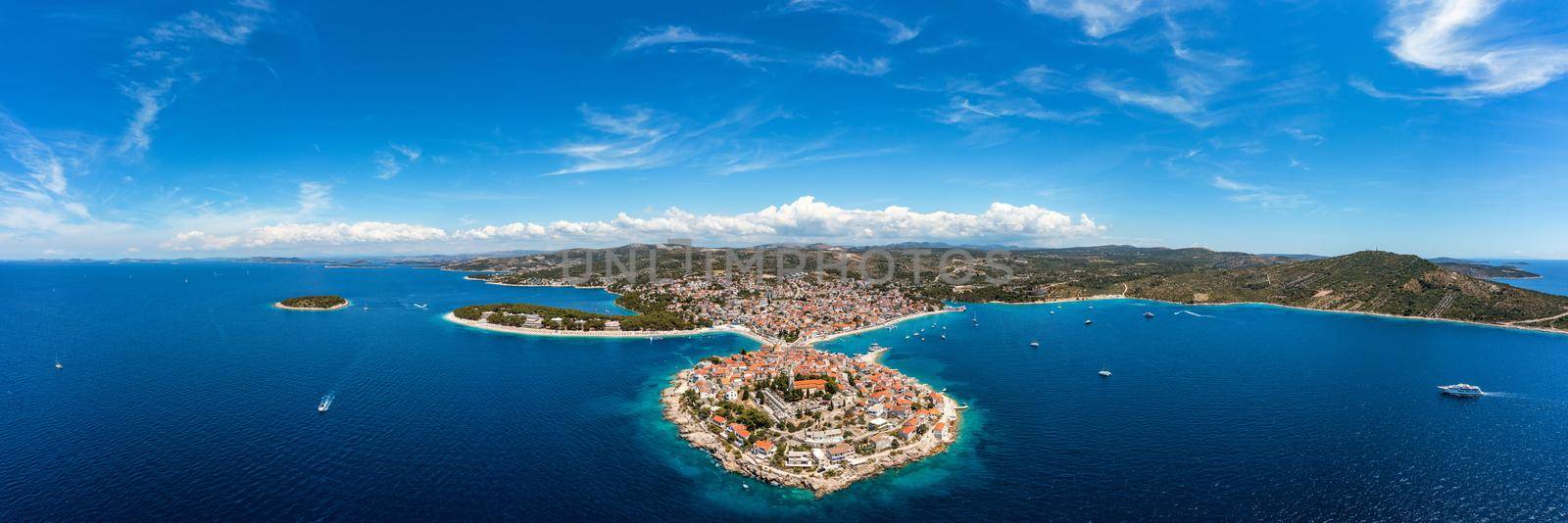 Aerial view of Primosten old town on the islet, Dalmatia, Croatia. Primosten, Sibenik Knin County, Croatia. Resort town on the Adriatic coast. Aerial view of adriatic town Primosten, Croatia