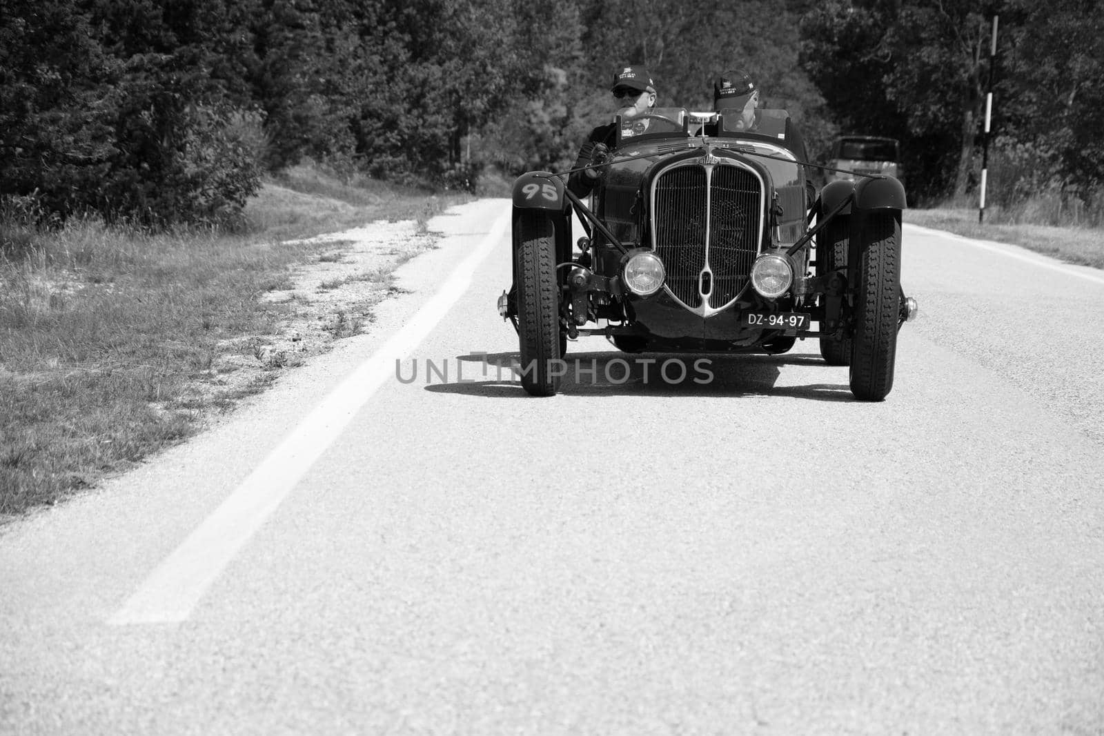 URBINO - ITALY - JUN 16 - 2022 : DELAHAYE 135 CS 1936 on an old racing car in rally Mille Miglia 2022 the famous italian historical race (1927-1957