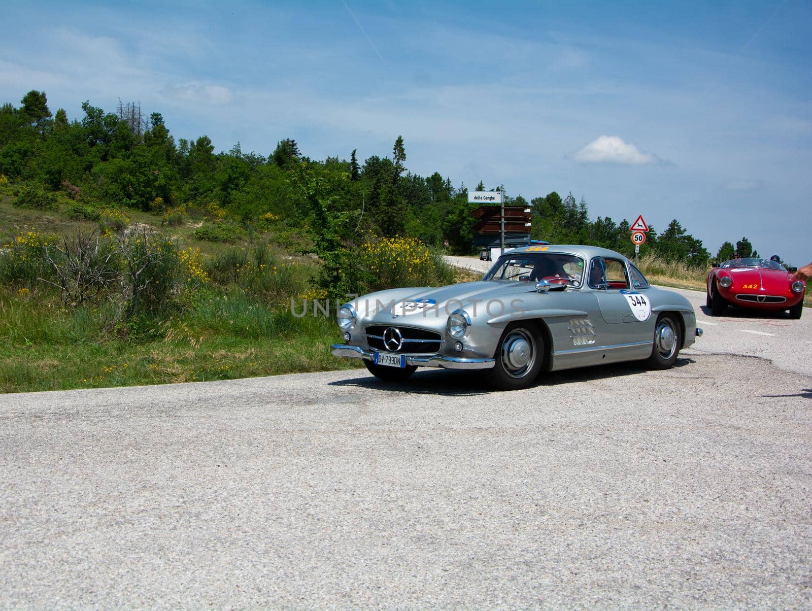 URBINO - ITALY - JUN 16 - 2022 : MERCEDES-BENZ 300 SL (W198) 1954 on an old racing car in rally Mille Miglia 2022 the famous italian historical race (1927-1957