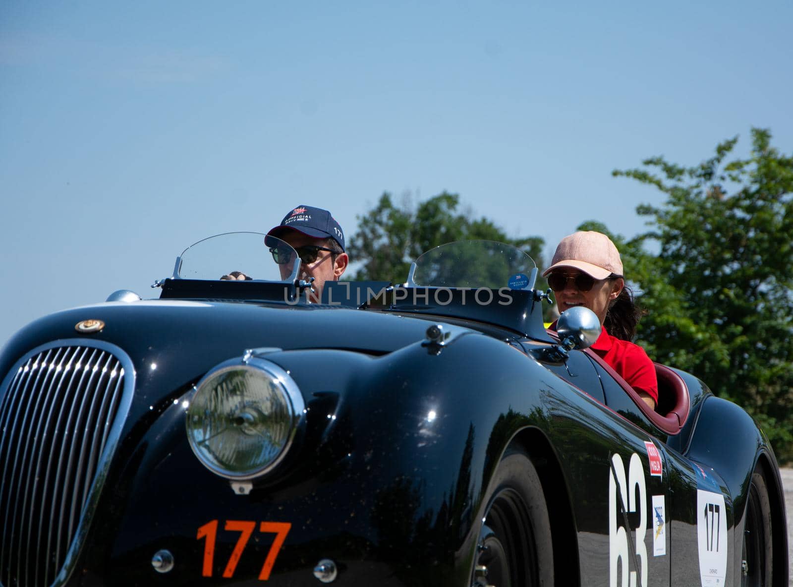 URBINO - ITALY - JUN 16 - 2022 : JAGUAR XK120 OTS ROADSTER 1950 on an old racing car in rally Mille Miglia 2022 the famous italian historical race (1927-1957