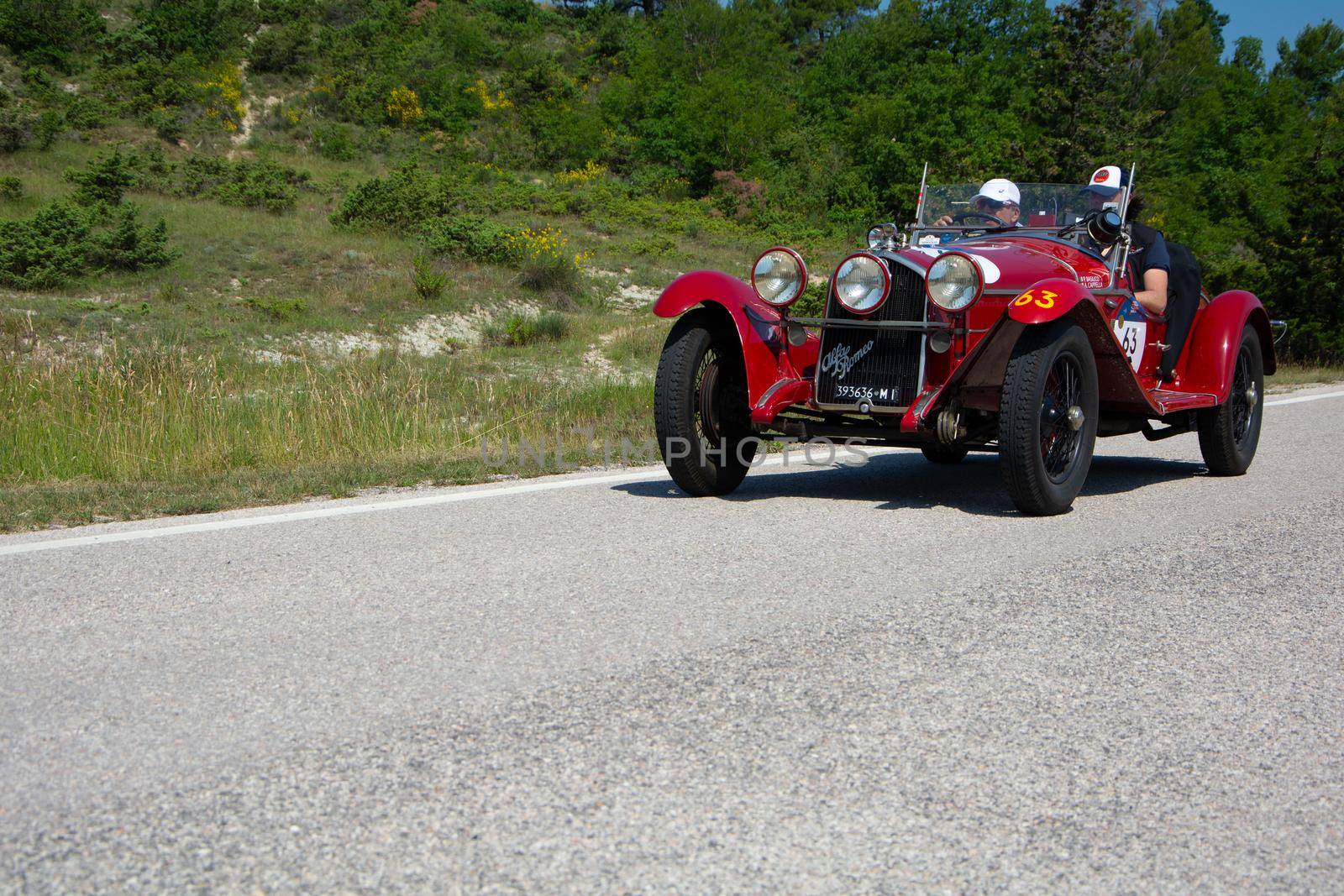 URBINO - ITALY - JUN 16 - 2022 : ALFA ROMEO 6C 1750 GRAN SPORT CARR. SPORT 1930 on an old racing car in rally Mille Miglia 2022 the famous italian historical race (1927-1957