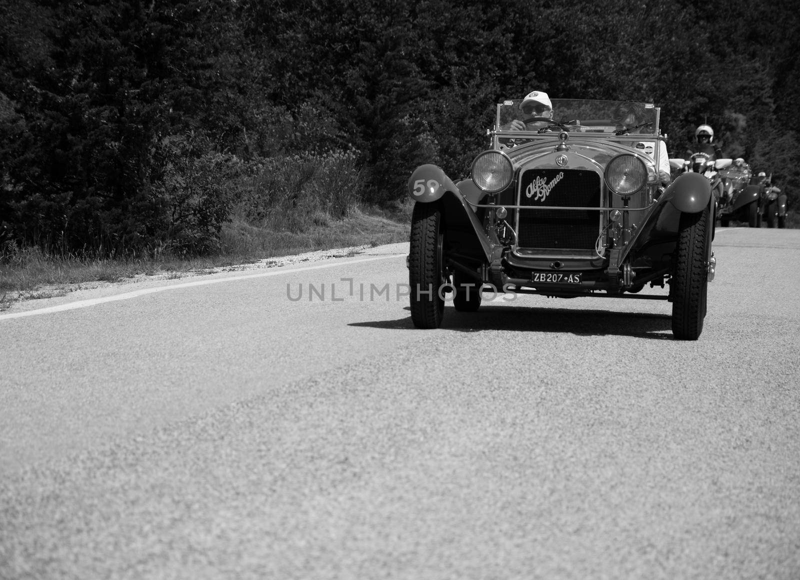 URBINO - ITALY - JUN 16 - 2022 : ALFA ROMEO 6C 1750 GRAN SPORT CARR. SPORT 1930 on an old racing car in rally Mille Miglia 2022 the famous italian historical race (1927-1957