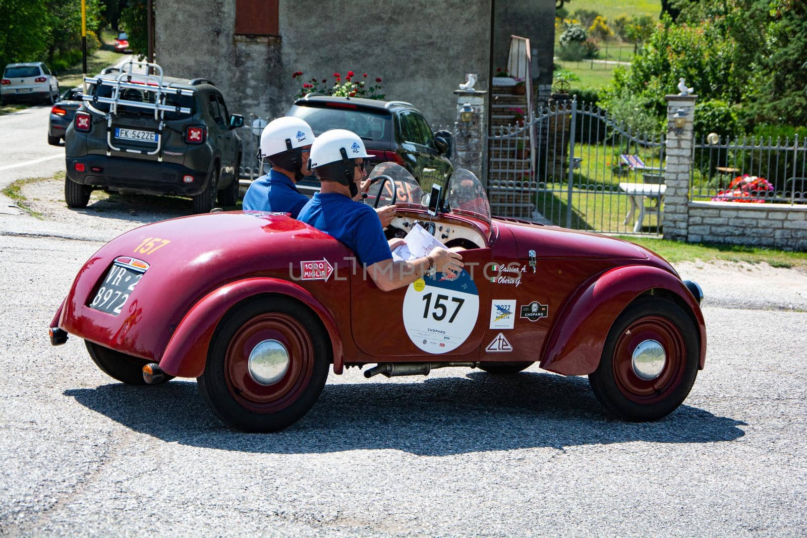 URBINO - ITALY - JUN 16 - 2022 : FIAT 500 SPORT 1949 on an old racing car in rally Mille Miglia 2022 the famous italian historical race (1927-1957