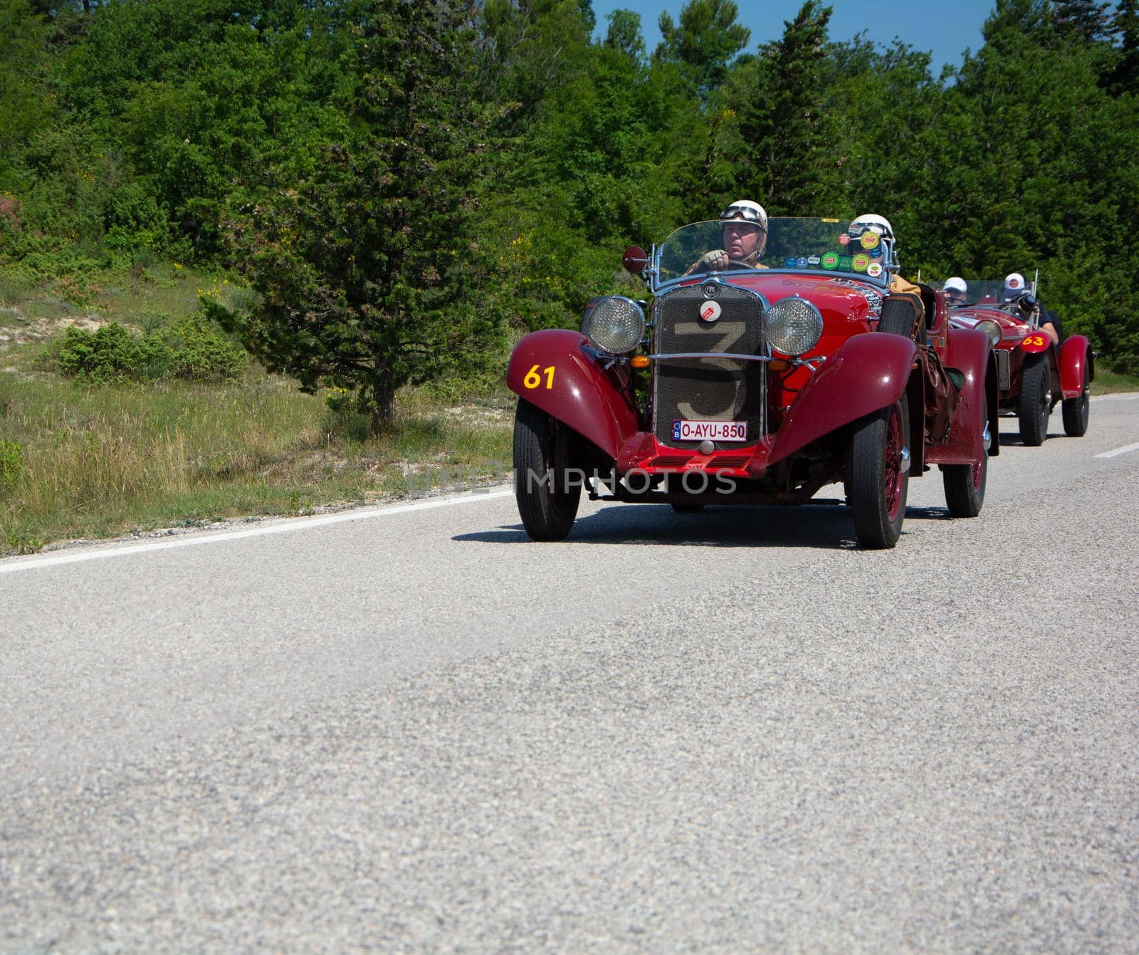 URBINO - ITALY - JUN 16 - 2022 : fiat on an old racing car in rally Mille Miglia 2022 the famous italian historical race (1927-1957