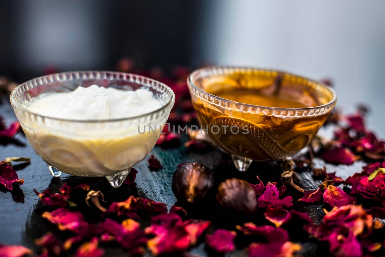 Nutmeg face mask to treat to even out discolorations and pigmentation on your face on the wooden surface consisting of Nutmeg powder, lemon juice, and curd.